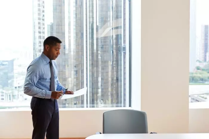 Real Estate Agent rehearses door knocking scripts