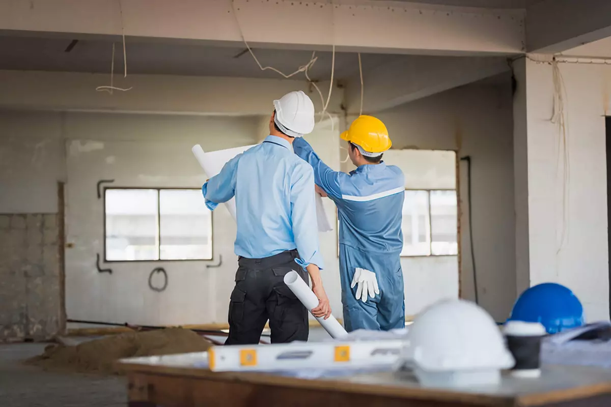 home renovation construction men fixing damp wall, wet wall, condensation, moisture