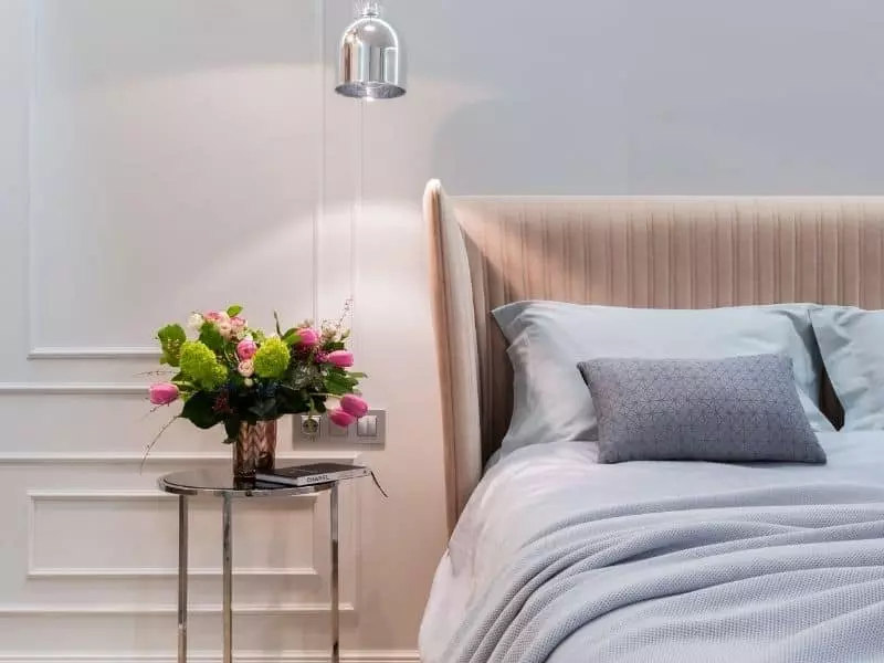 bed with bedside table