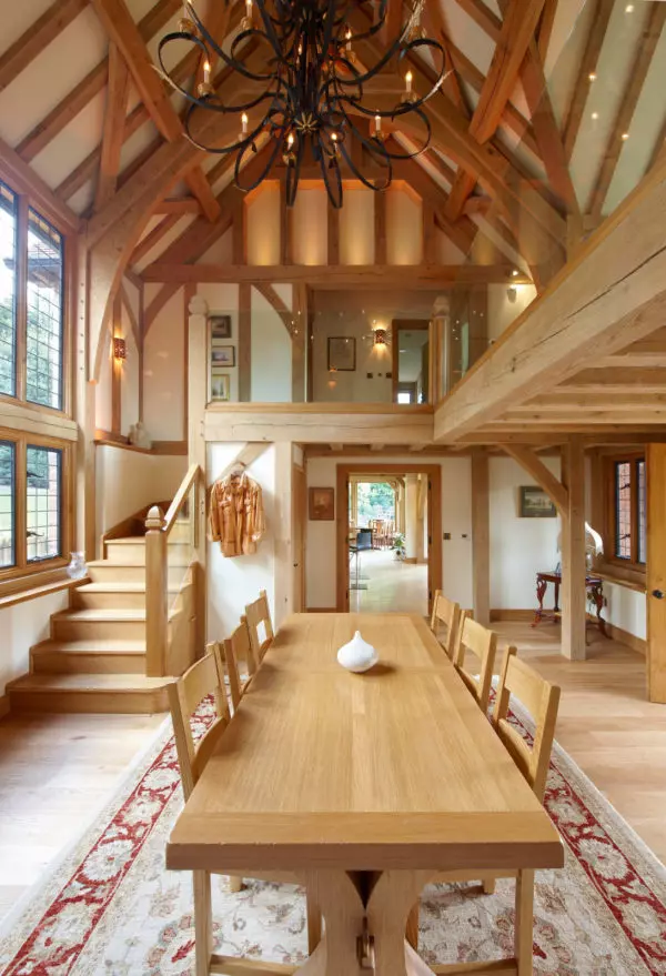 century-old fireplace in a tudor style house interior for a regal yet comfy living room