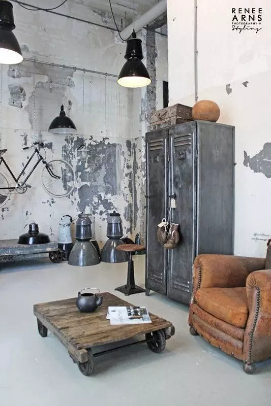 Industrial Living Room with Metal Beams and Black Pipes Visible via Melissa Winn Interiors