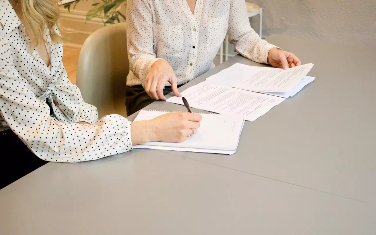 A lawyer and a client at a table