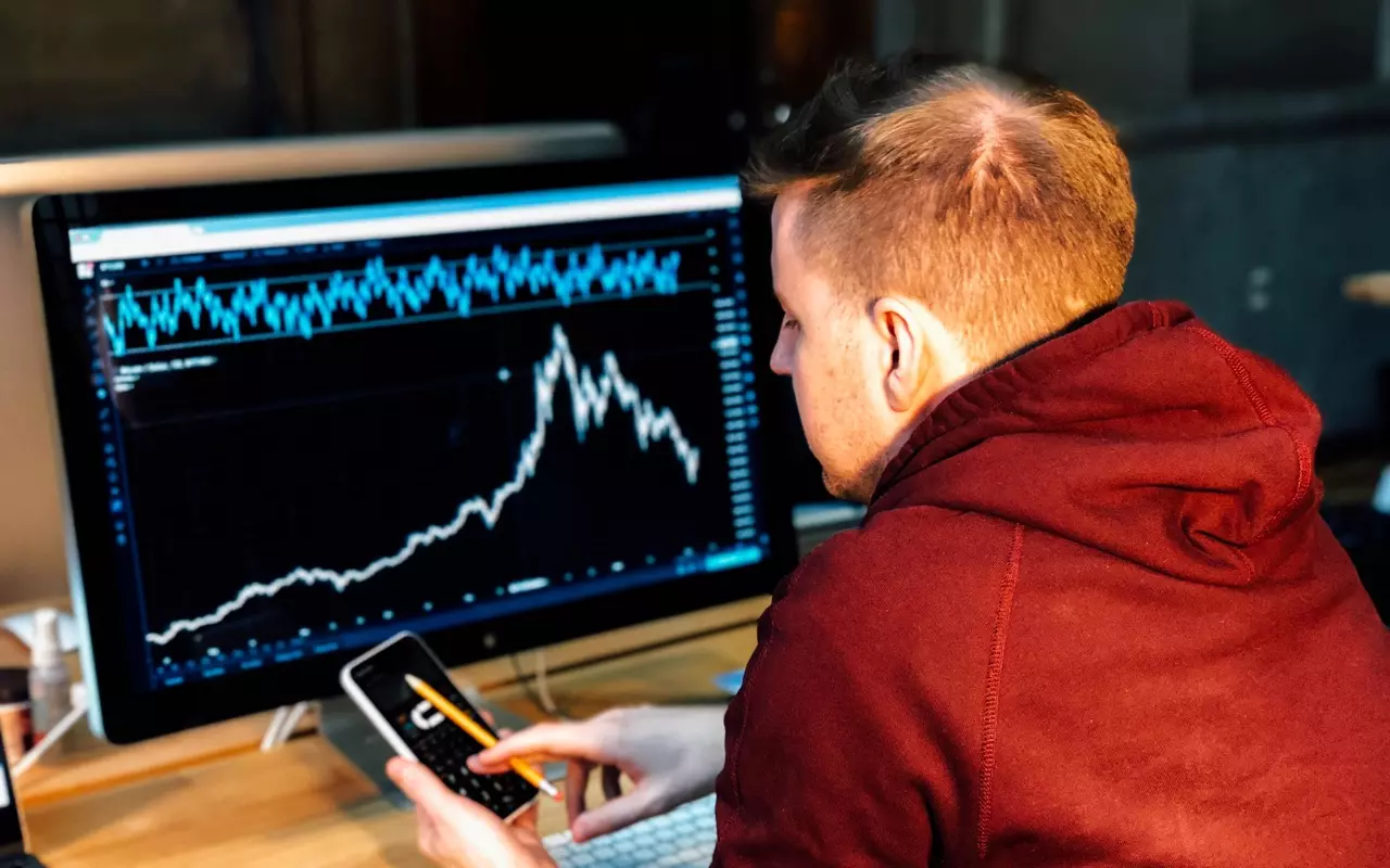 A man checking his financial portfolio