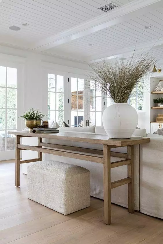 Love this beautiful living room with a wood console table and neutral furniture and decor - living room decor - living room furniture - transitional interior design - coastal living rooms - home - style - pure salt interiors