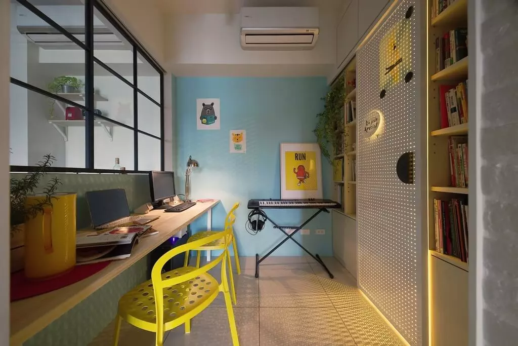 A living room filled with furniture and a bookshelf