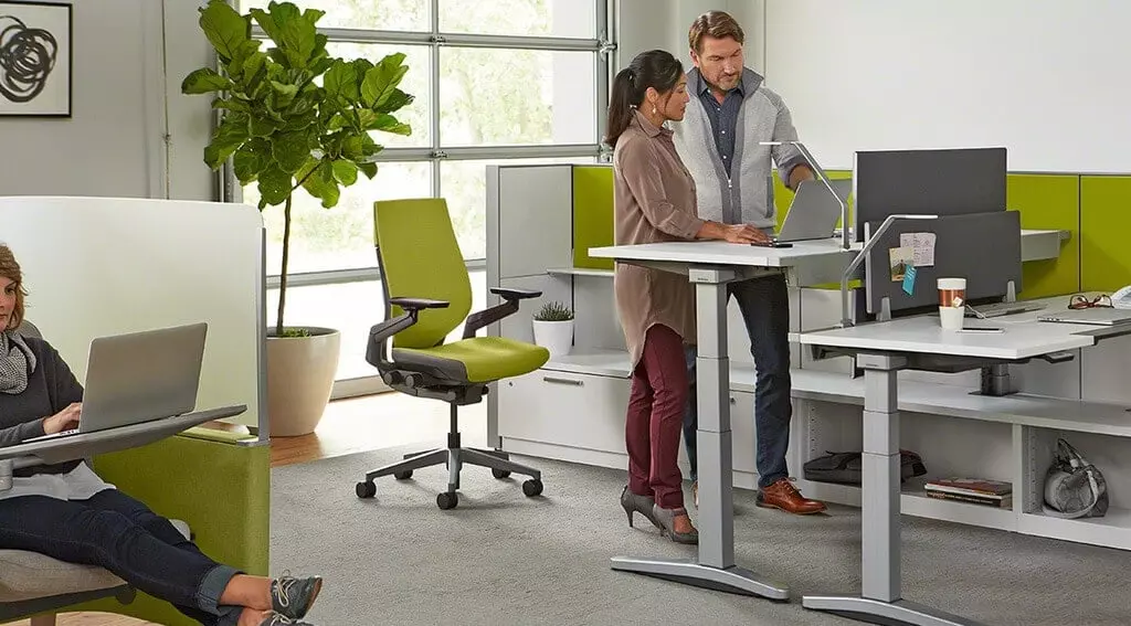 Two pictures of a home office with a desk and chairs