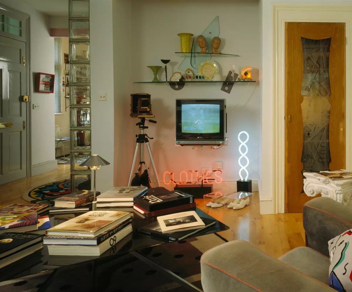 Neon lighting and portable television in nineties living room