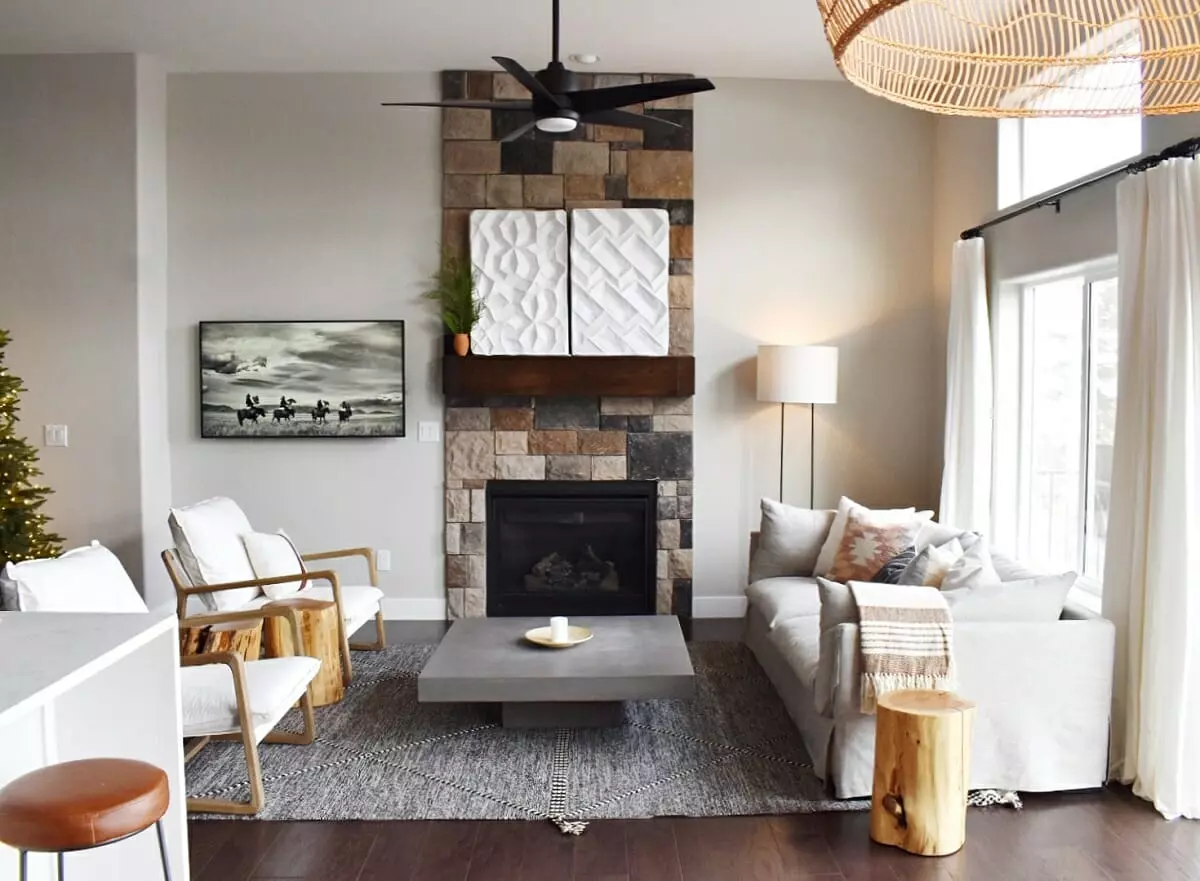 Small cabin interior with a stone fireplace