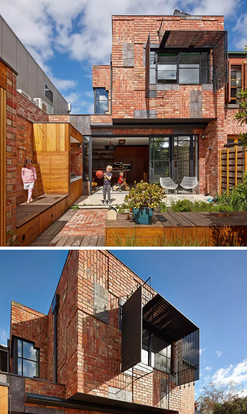 Bricks arranged in different directions create a patchwork design on the exterior of this family house.