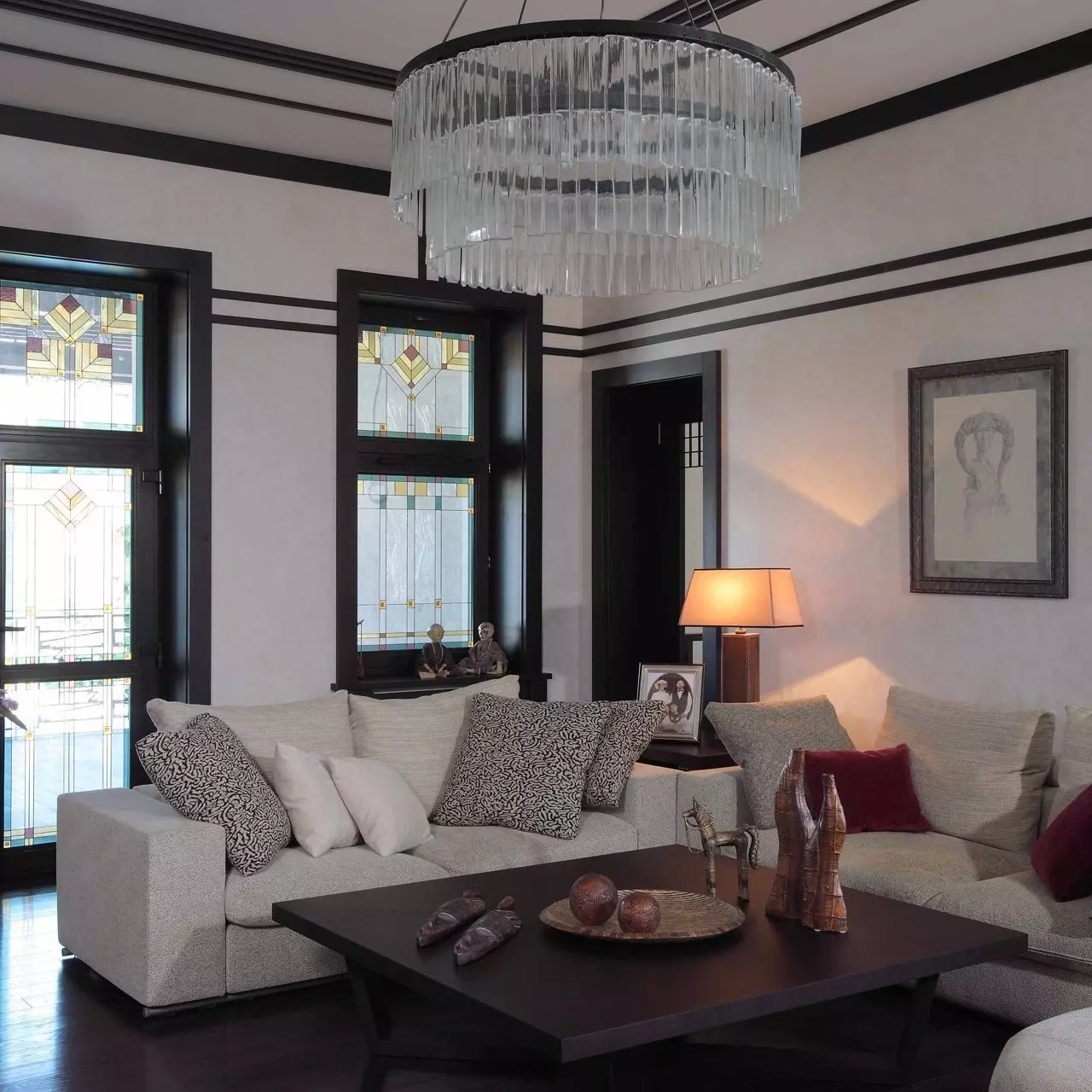 Contrasting white and black color scheme in the German-styled living room with a dark floor