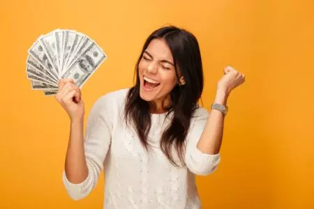 woman happy holding investment trust income