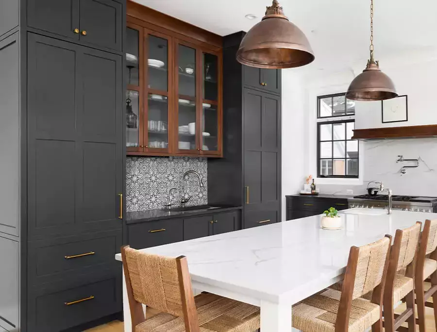 Modern white Shaker style cabinets with gold hardware.