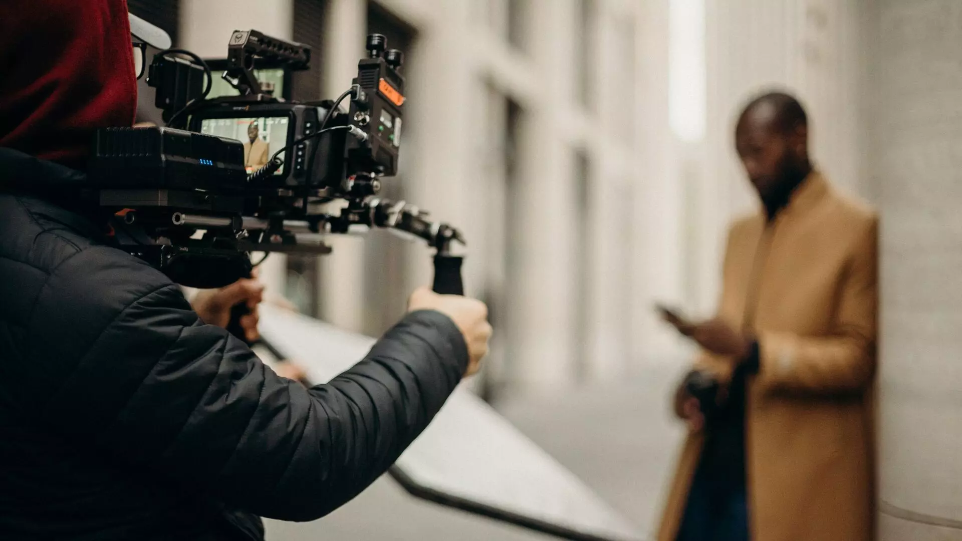 Photographer capturing real estate photos with agent in frame