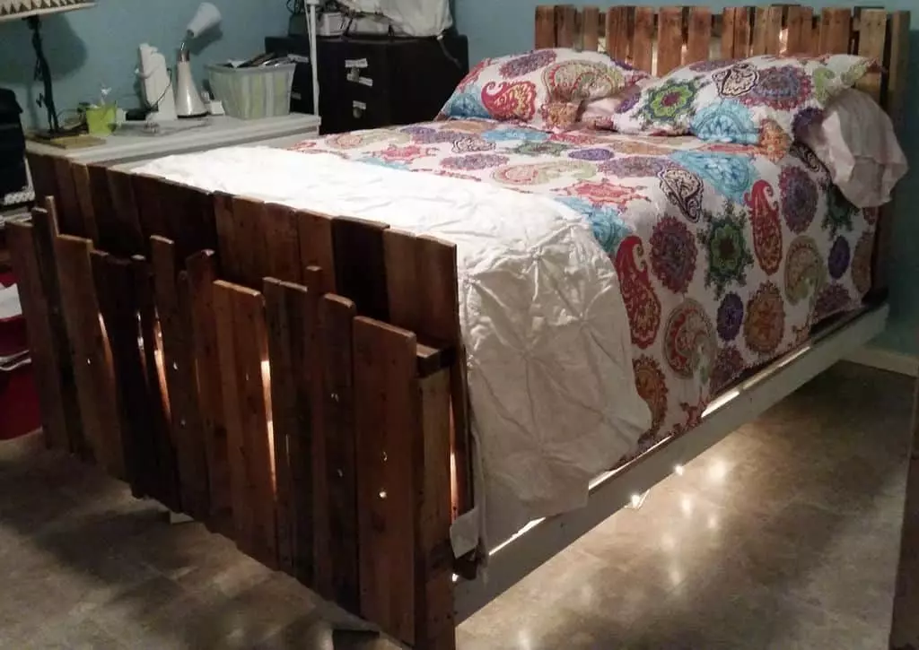 Pallet bed with two people in it