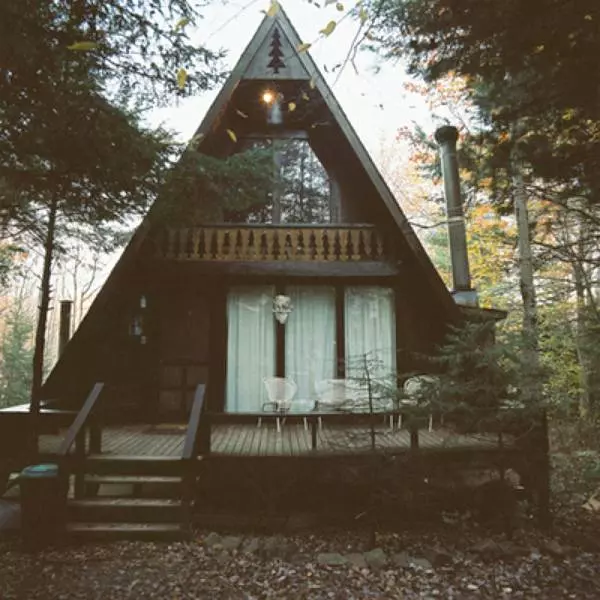 Triangular house exterior with large windows