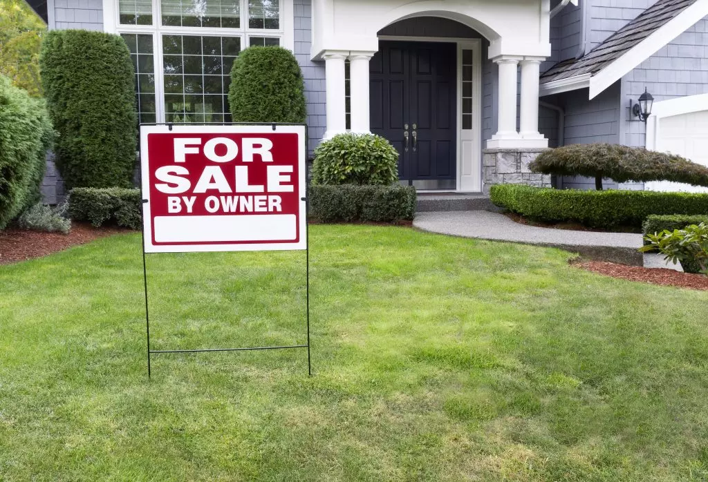 A real estate agent talking to a couple