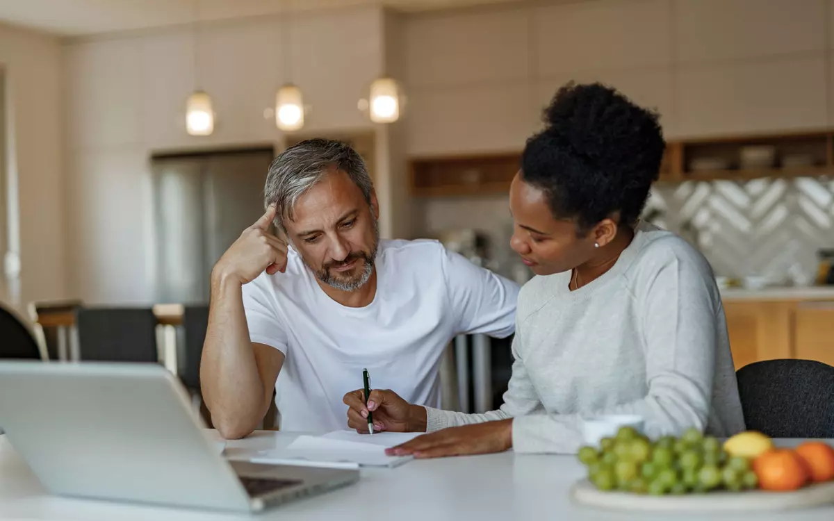 Couple Signing Paperwork - Homebuyer.com