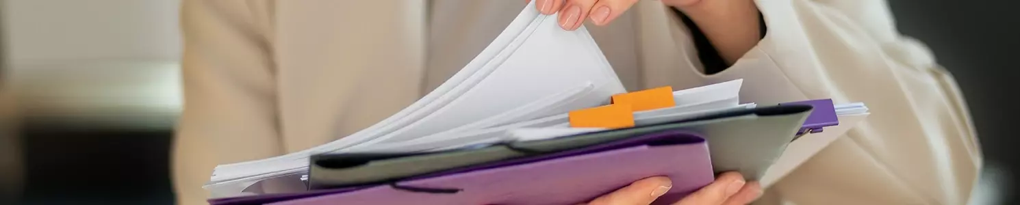 A woman checking every document in folder