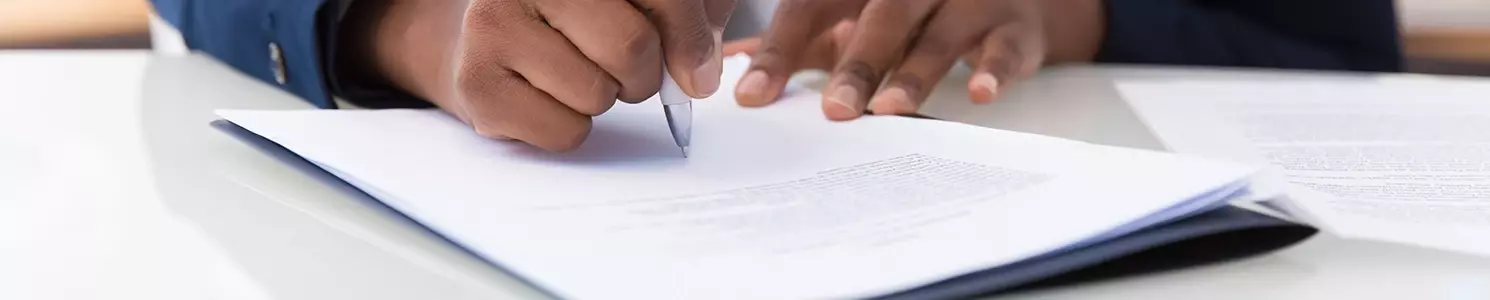 A woman talking to someone to guide her in writing abstract of title