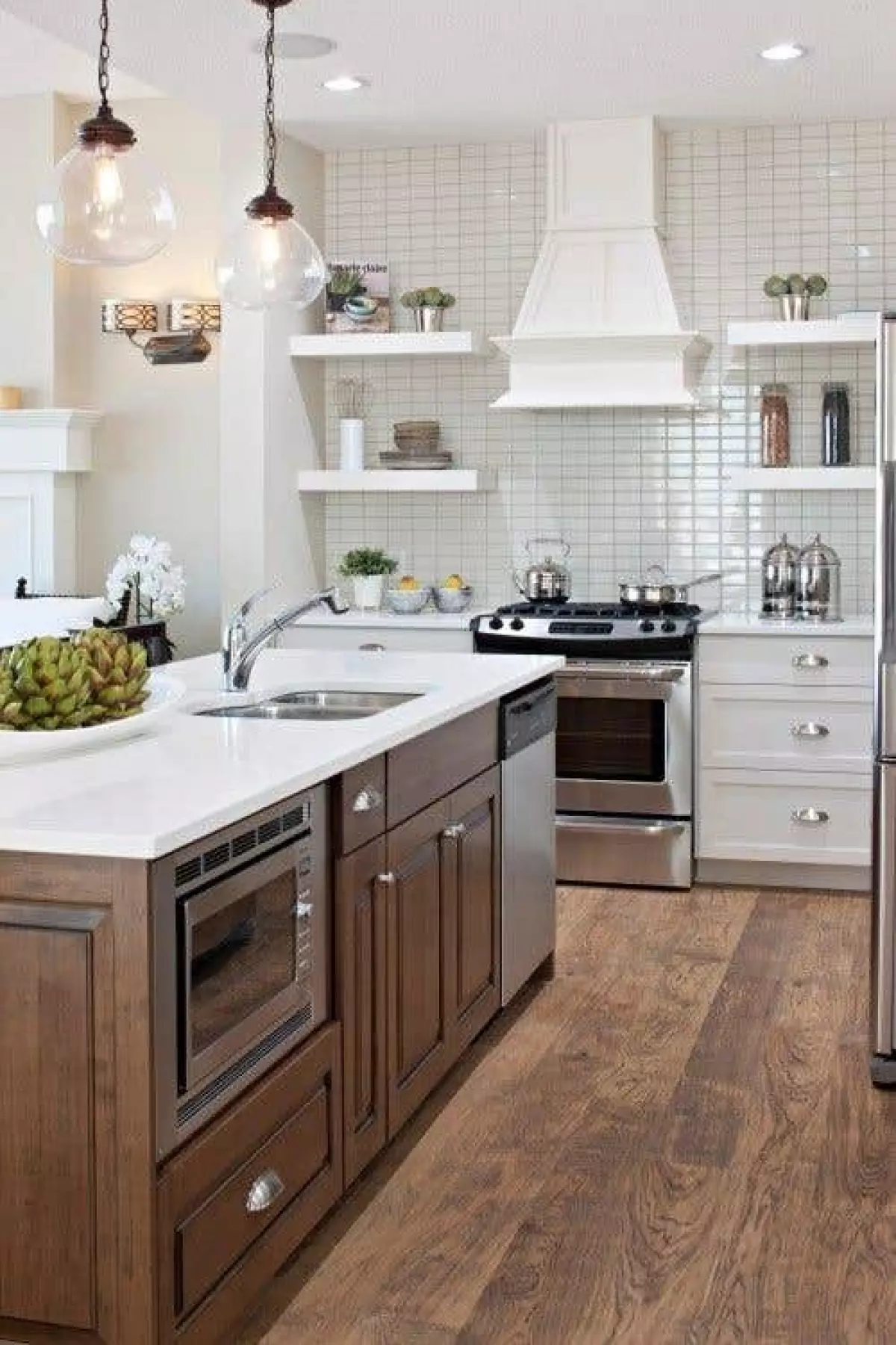 Kitchen Design Features White Cabinets and Microwave Cabinet Built-in in Island