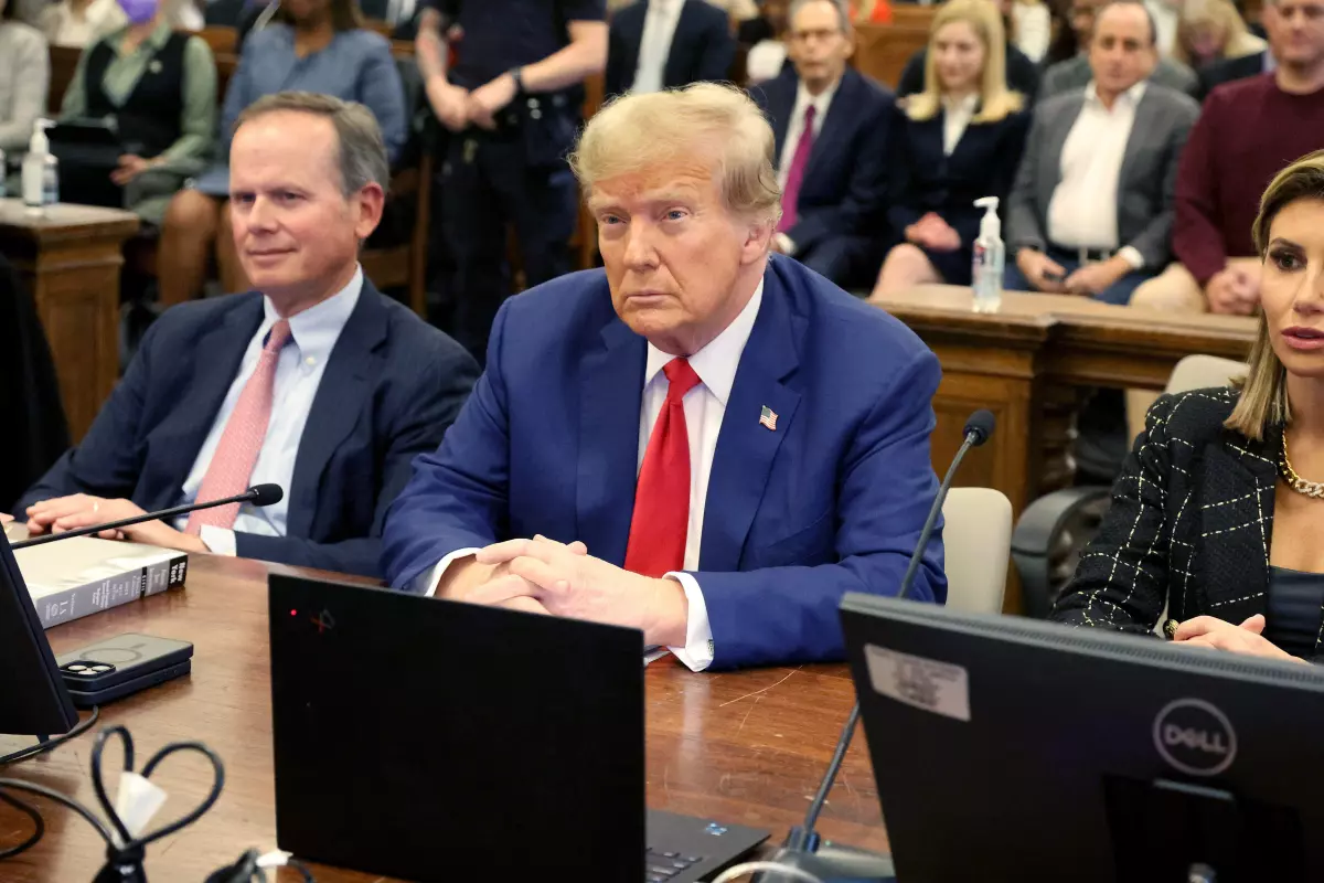 Donald Trump seated in a courtroom during his civil fraud trial in New York City.