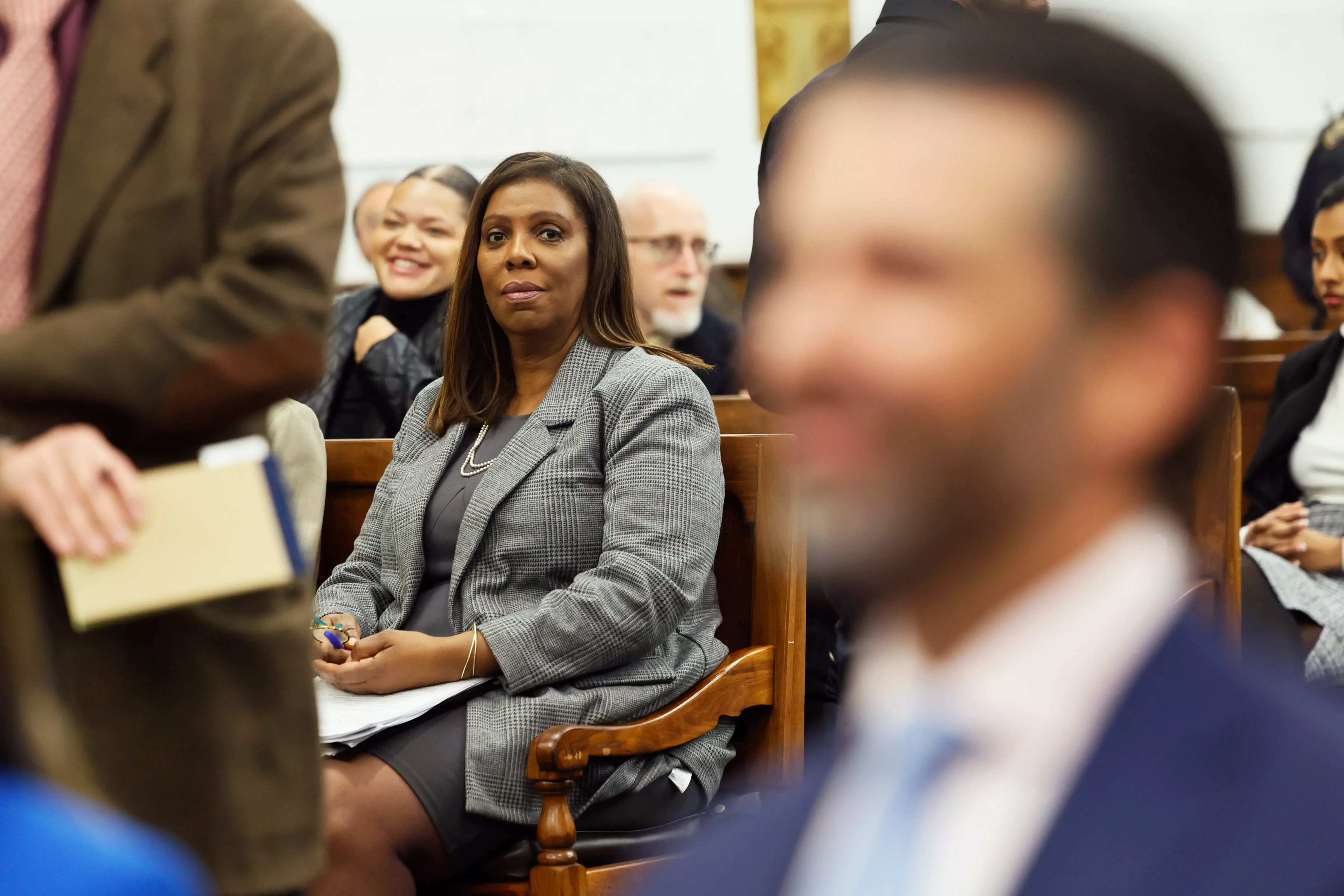 Attorney General Letitia James seated in court during a proceeding.