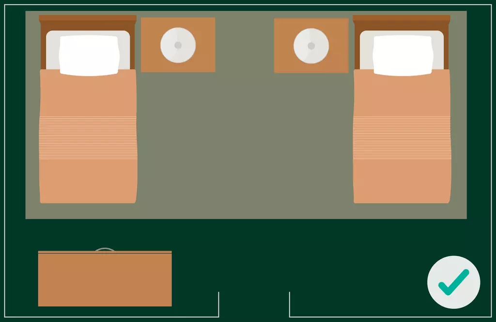 Correct Feng Shui bed placement - Both beds are turned and placed against the back wall, allowing each bed to have a clear view of the doorway without being directly aligned with it.