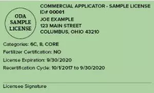 View of front of green commercial applicator license.